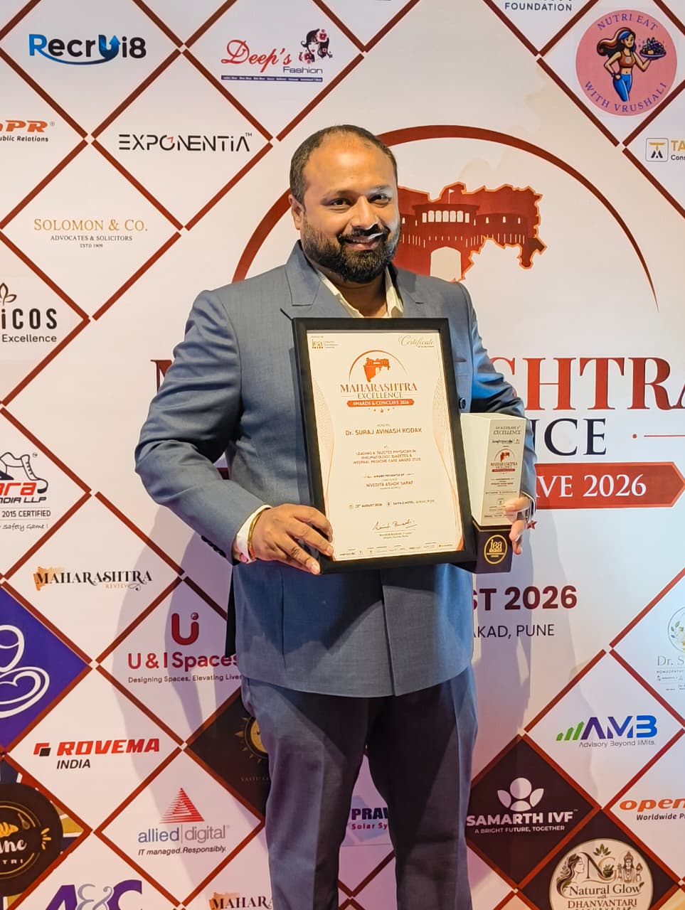 Dr. Suraj Avinash Kodak with the Maharashtra Excellence Award certificate